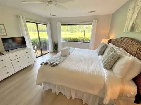 Bedroom with porch access at an Inverness Village villa