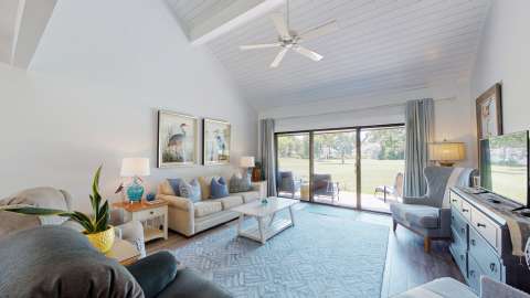 Living room with porch access at an Inverness Village villa