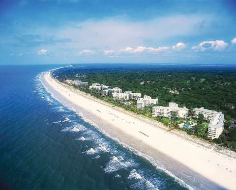 Aerial view of Palmetto Dunes beach and buildings