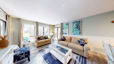 Living room with access to the balcony at The Moorings