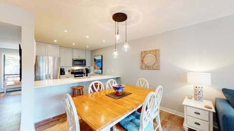 Dining area with kitchen at The Moorings