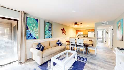 Living room with dining and kitchen at The Moorings
