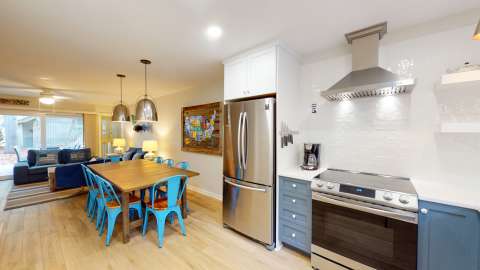 Kitchen leading the dining and living area in a Water Oak Villa