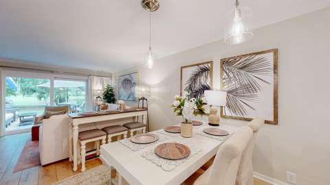 Dining and living room in a villa at Water Oak