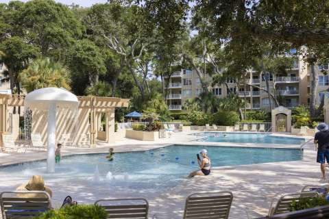 Community pool at Windsor Place with people enjoying the day