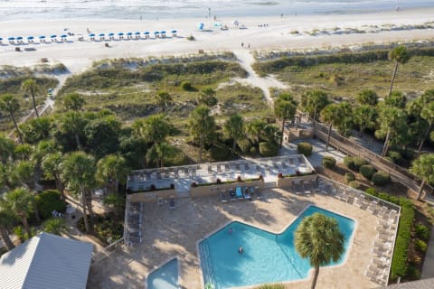 Aerial view of community pool with beach access at Captain's Walk