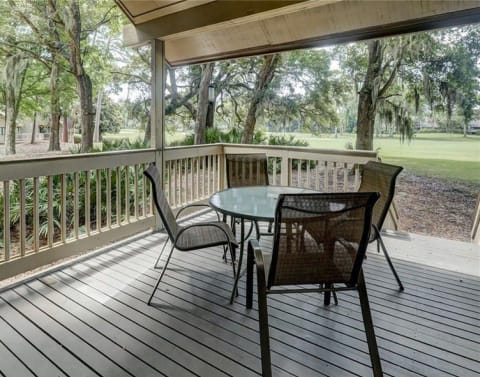 Porch with a table at a villa in Fazio Villas