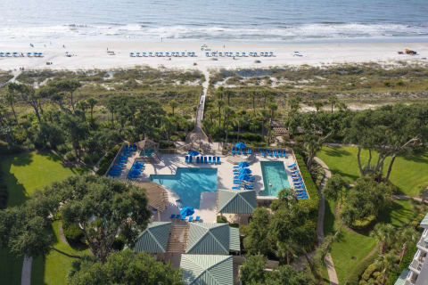 Aerial view of the pool and beach access at Hampton Place Villas