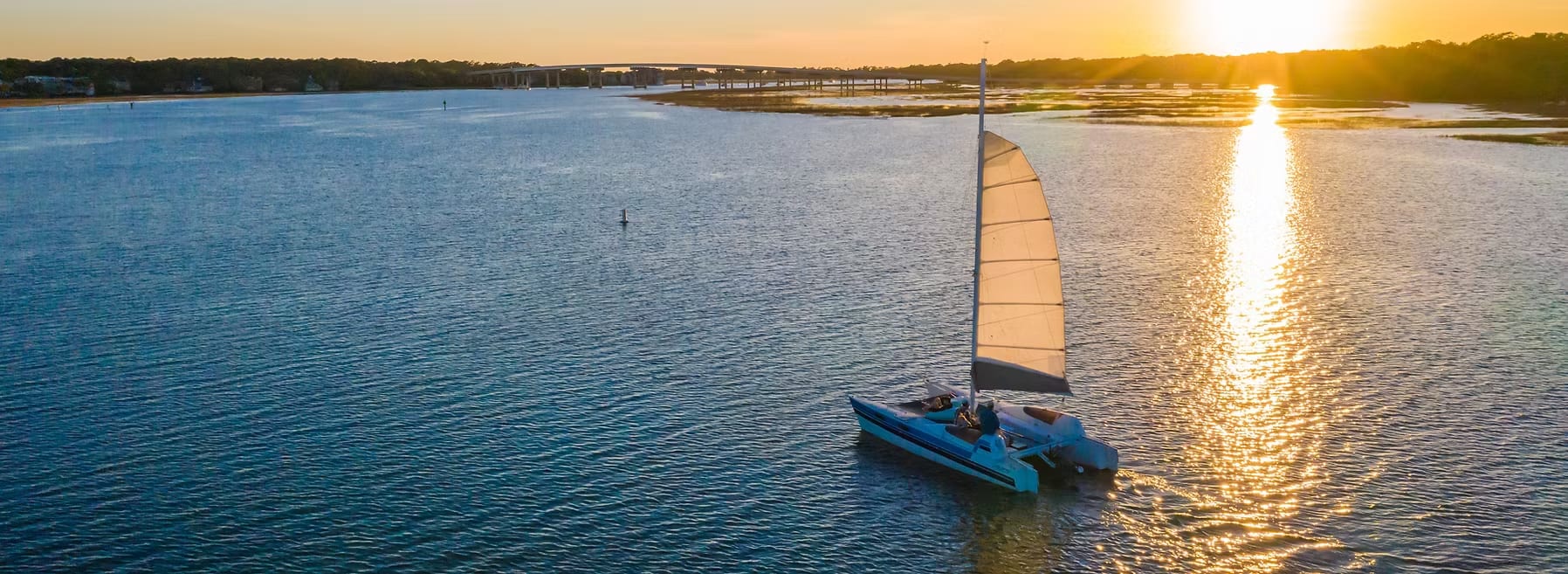 Salt Marsh Sailboat riding off into the sunset