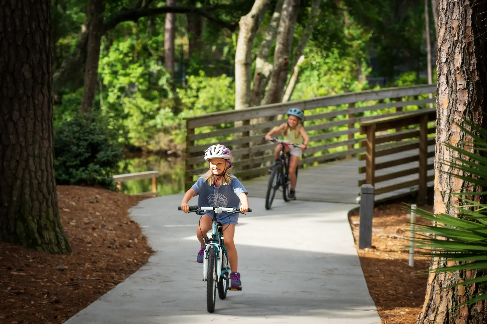 Girls on bikes on a path