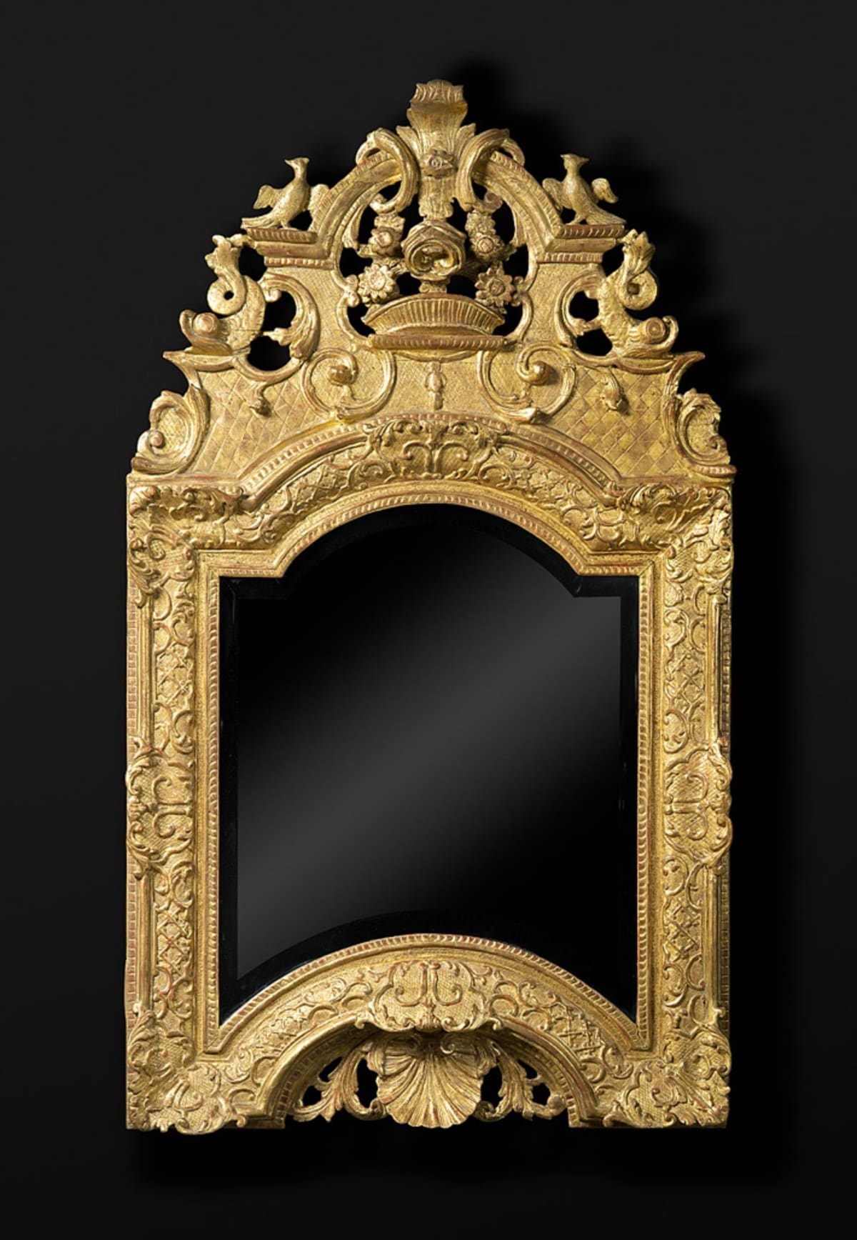 CARVED AND GILDED WOODEN MIRROR