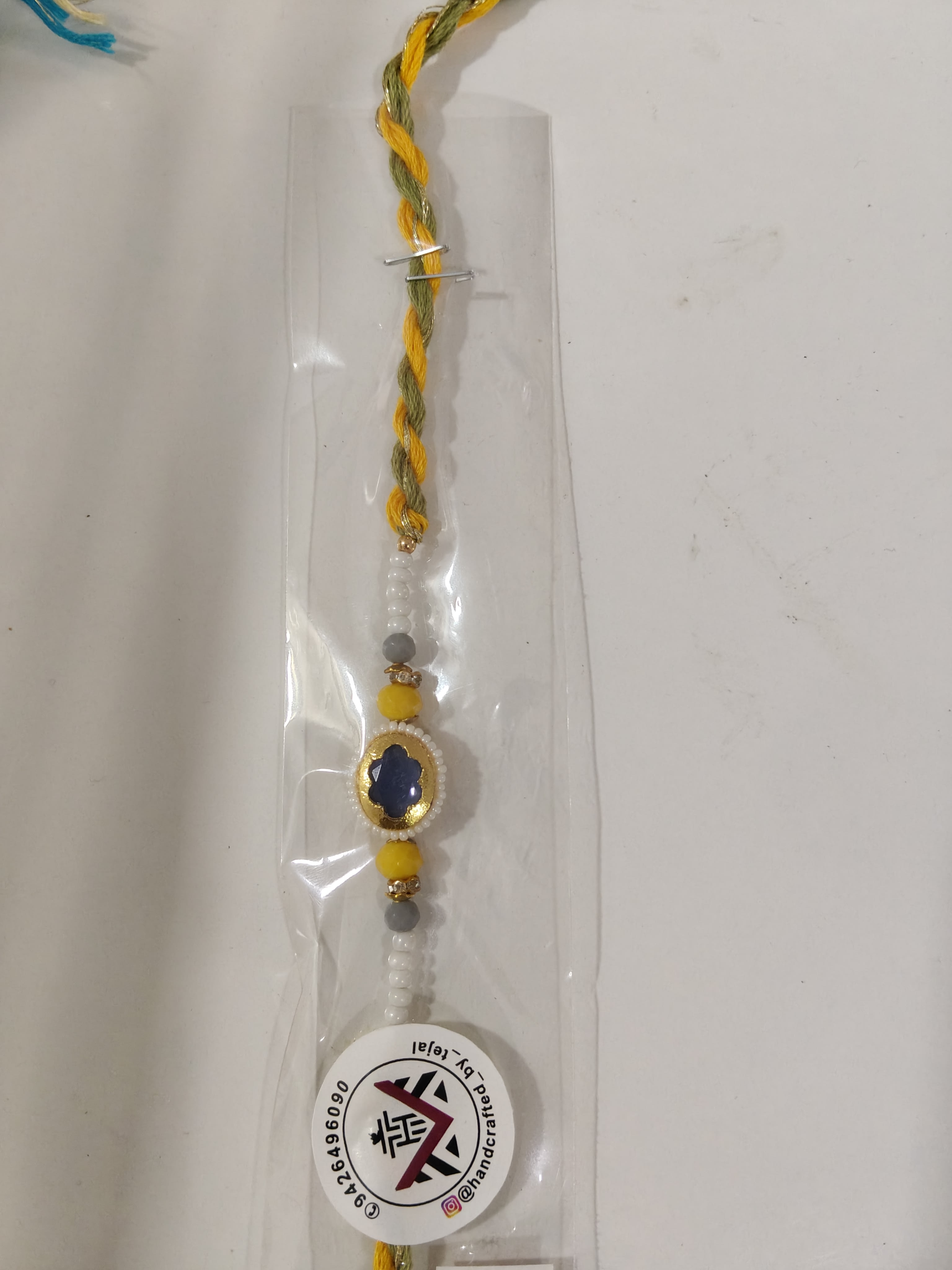Midnight stone and golden rakhi