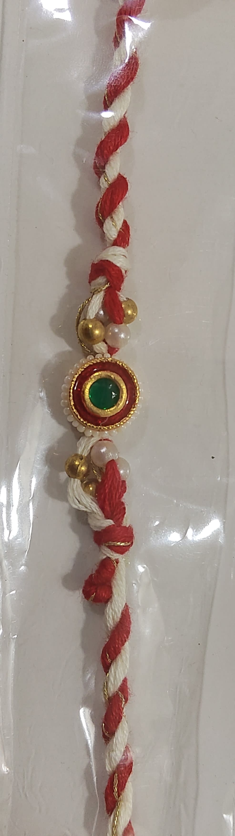 Small red Kundan rakhi