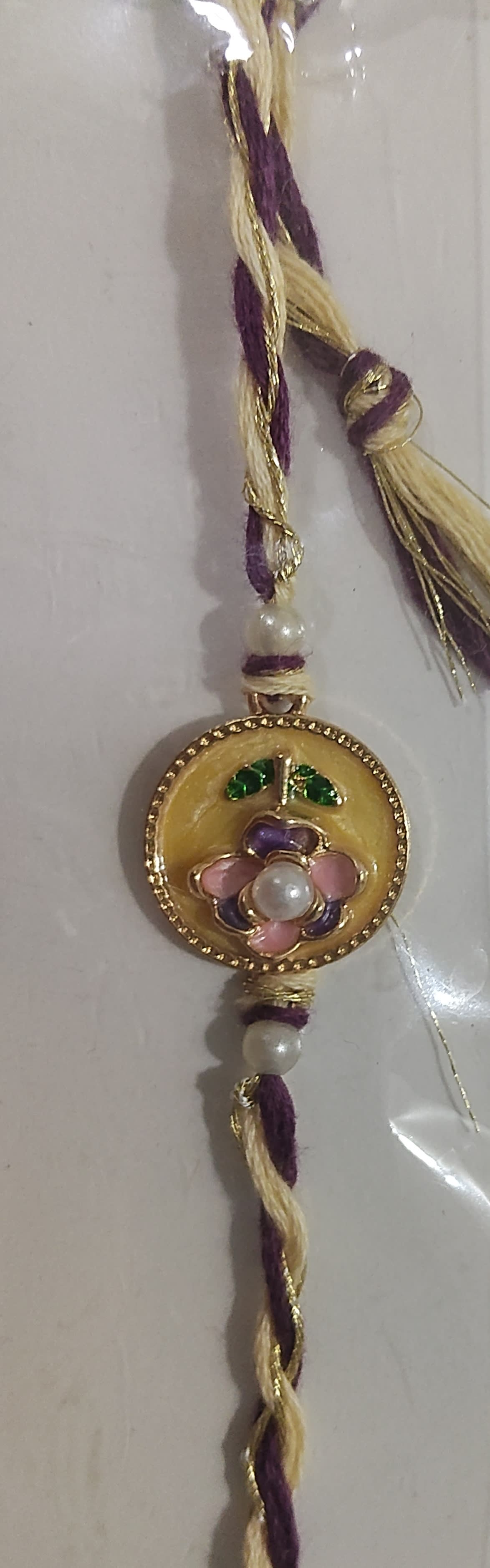Purplepink flower rakhi