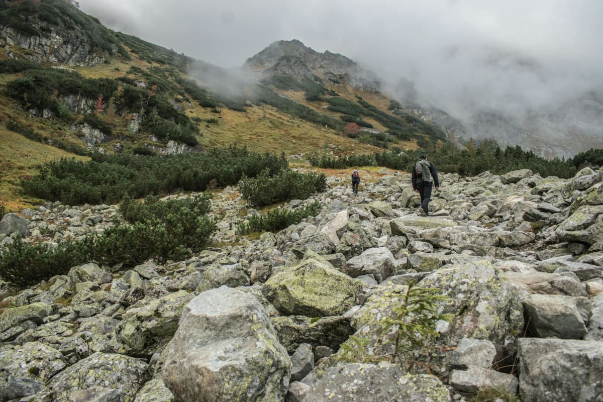hiker boots mud scree alpine terrain autumn