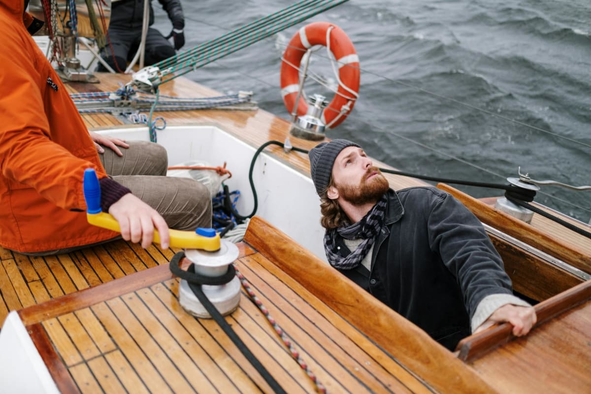 summer sailing crew working winches Mediterranean afternoon light