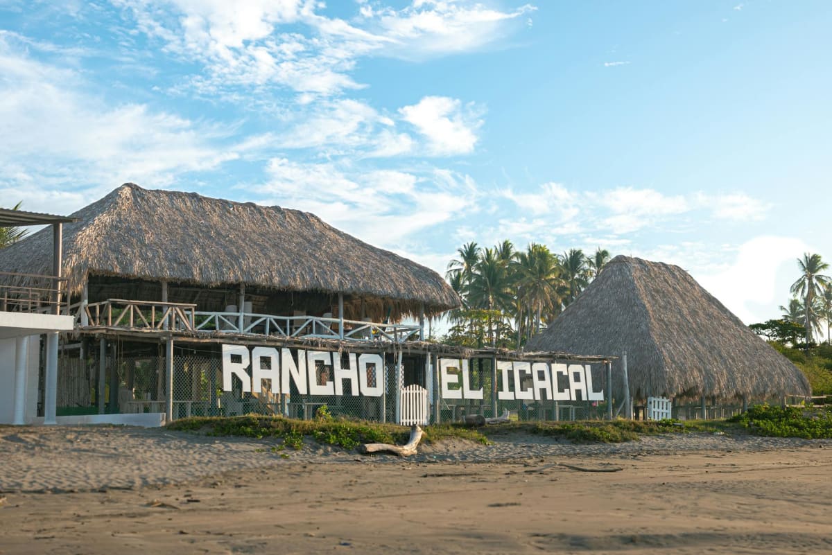 luxury beachfront resort bungalow palm trees Central America