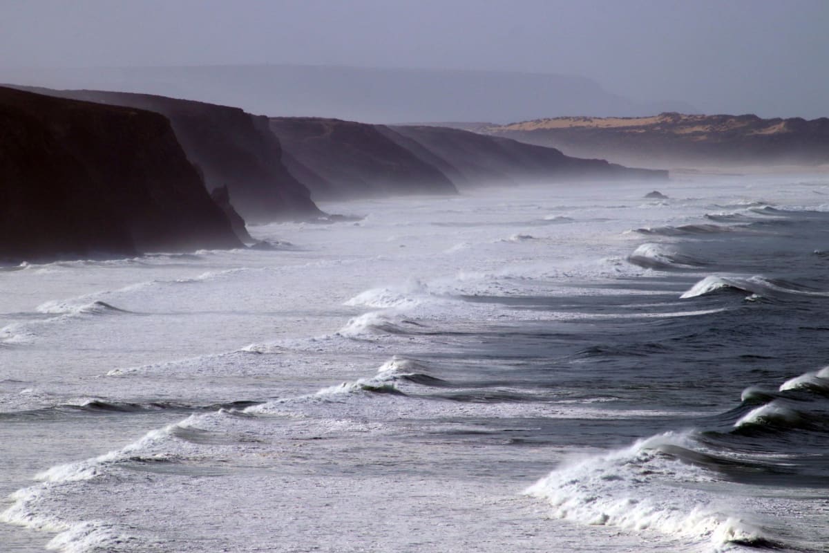 Arrifana Portugal southwest coast reef right-hander barrel wave