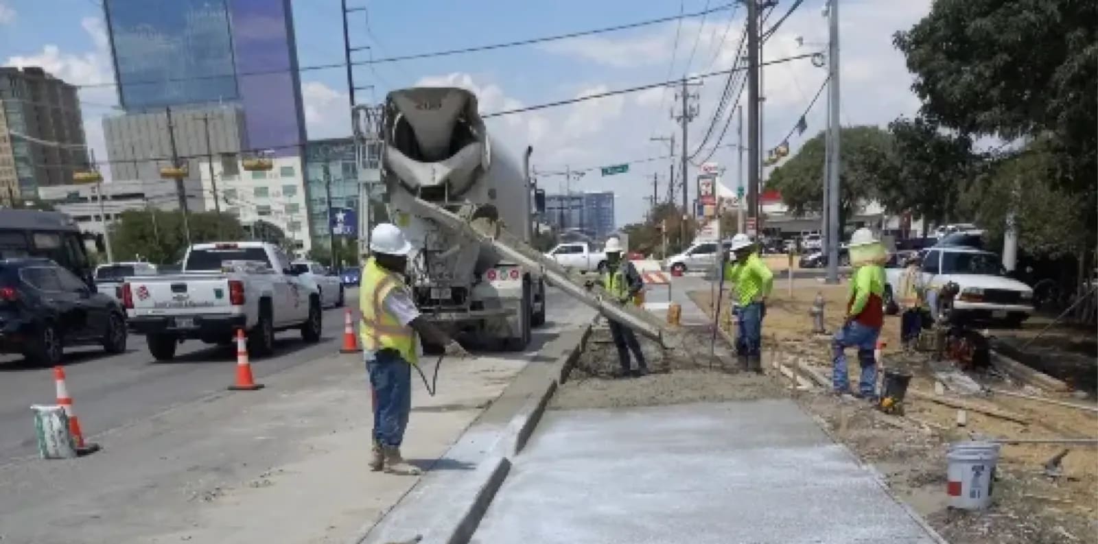 Concrete repair process with construction workers