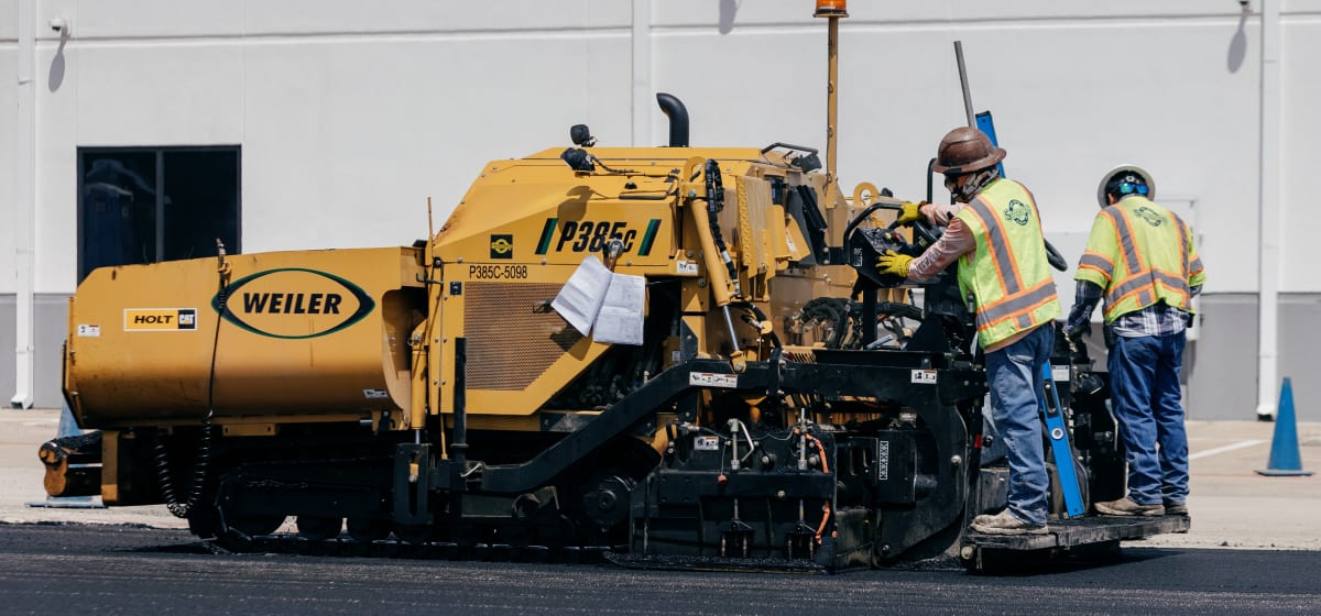A paving crew at work on a commercial site north of Austin.