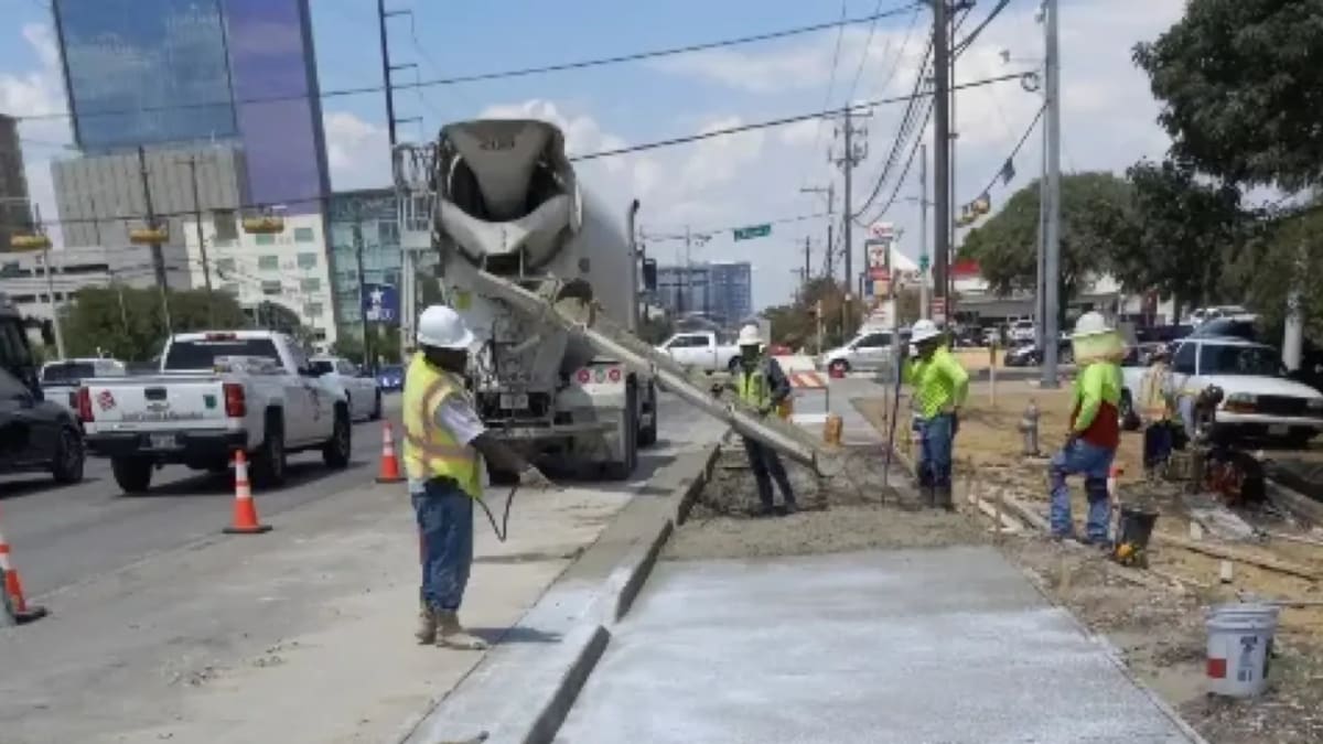 Concrete repair process with construction workers
