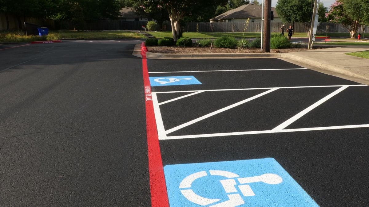 ADA compliant parking space marking with wheelchair symbol