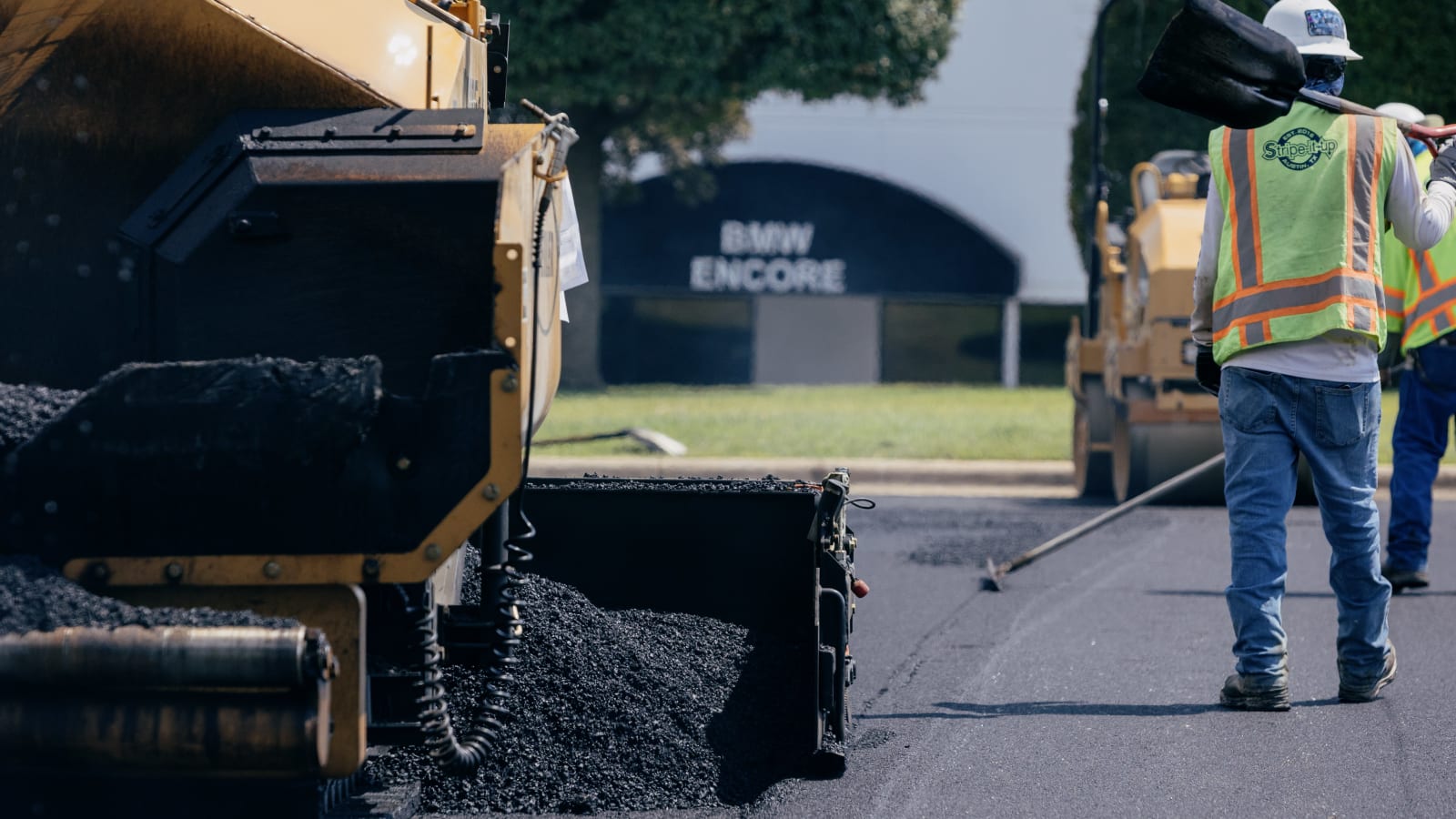 A Stripe-It-Up paving crew working together on a Central Texas job site.