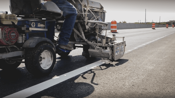 Thermoplastic markings being applied to a parking lot.