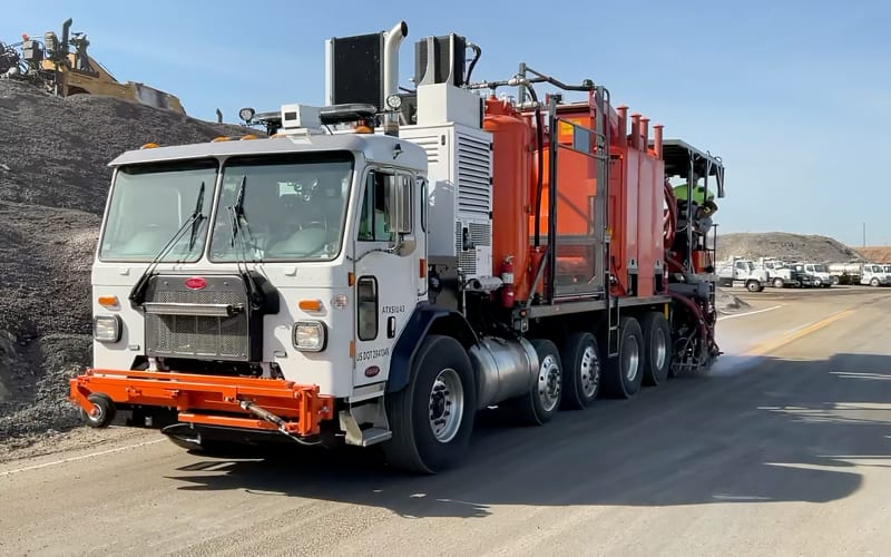 Long-line striping equipment on a roadway job.