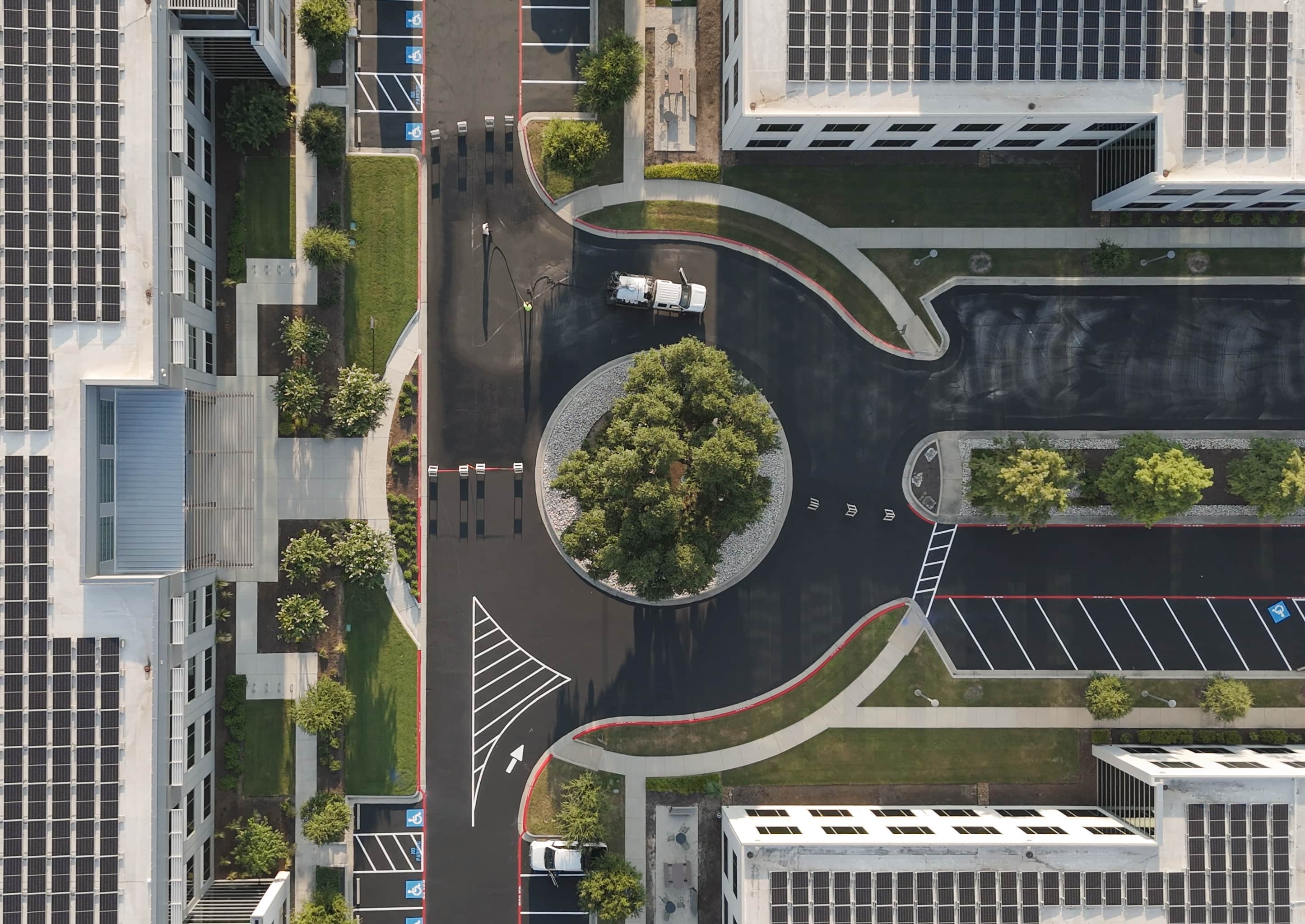 Aerial view of parking lot sealcoat and striping being appliedin Austin, Texas