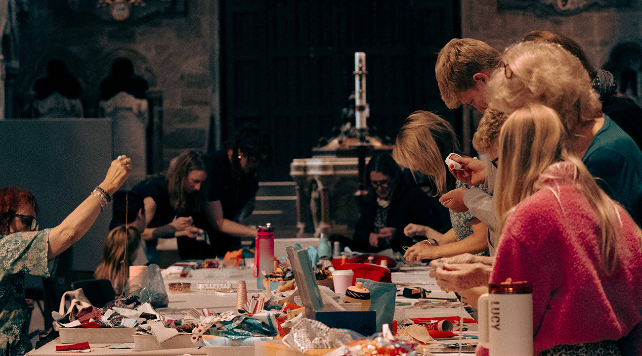 Lichfield Cathedral celebrates the completion of the Common Threads Table Runner