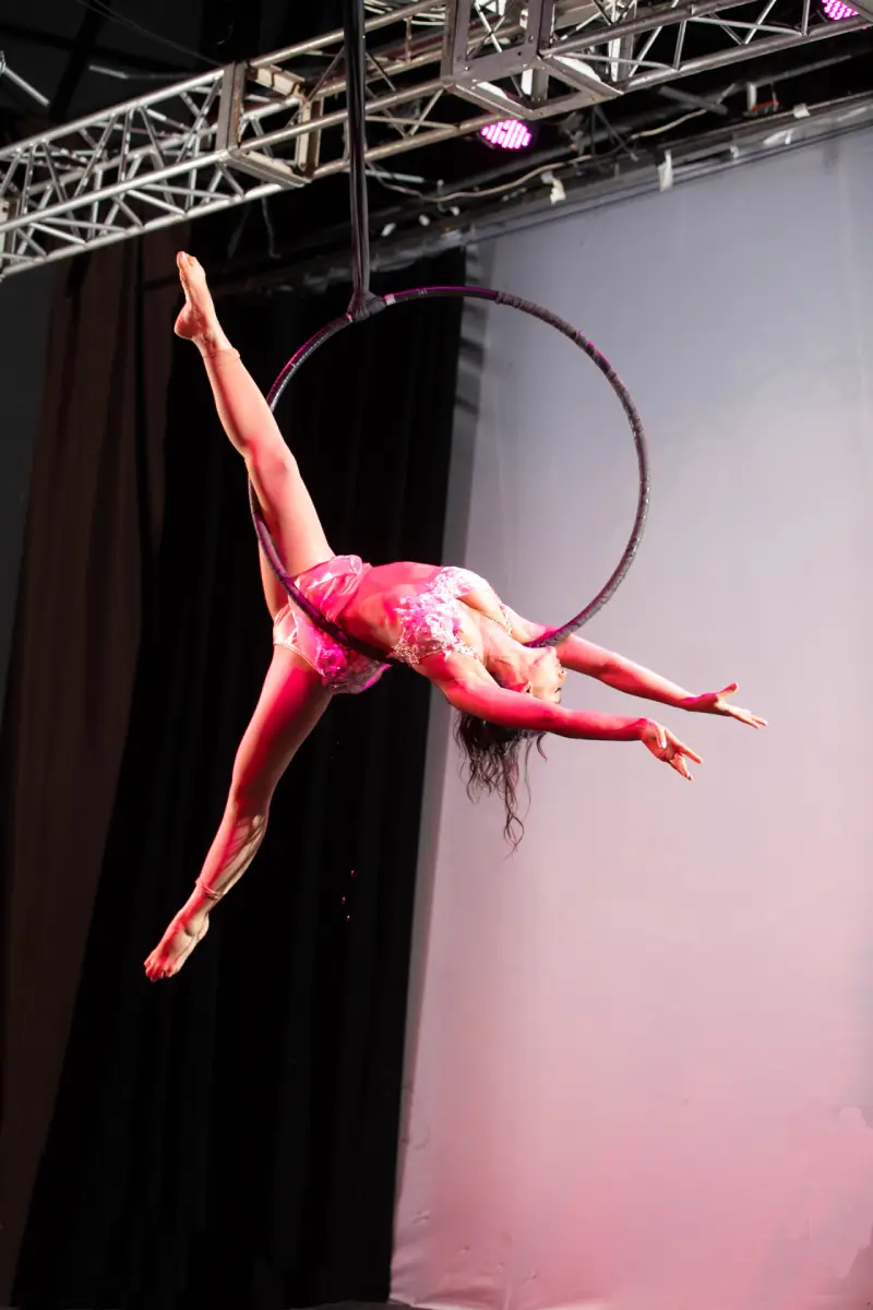 Aerial hoop artist in graceful pose