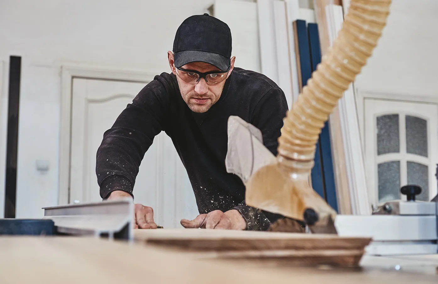 Sawing up of a wooden board on a sliding table saw