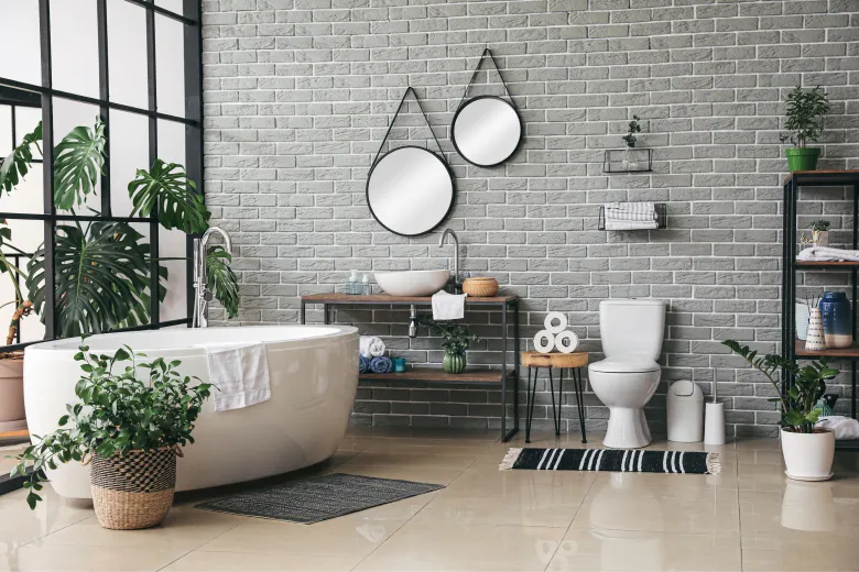 a beautiful, modern bathroom with plants and bright light