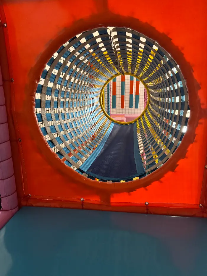 A safe children's soft playground with a colorful ball pool, slides and climbing areas.