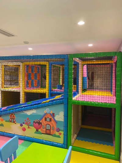 In the indoor playground designed by our company, the cute house patterned slide and tunnel details offer a safe environment for children to explore.