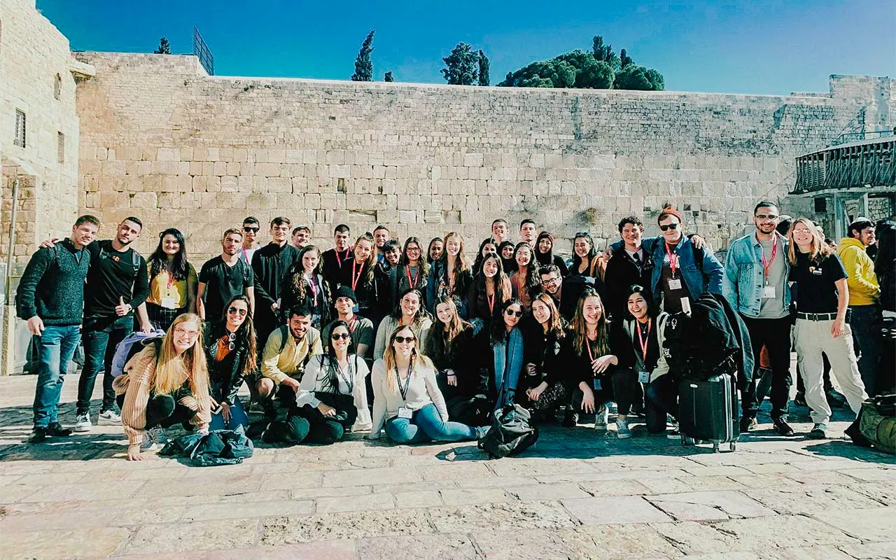 Snir Lasri with his Birthright Israel group at the Kotel in 2019