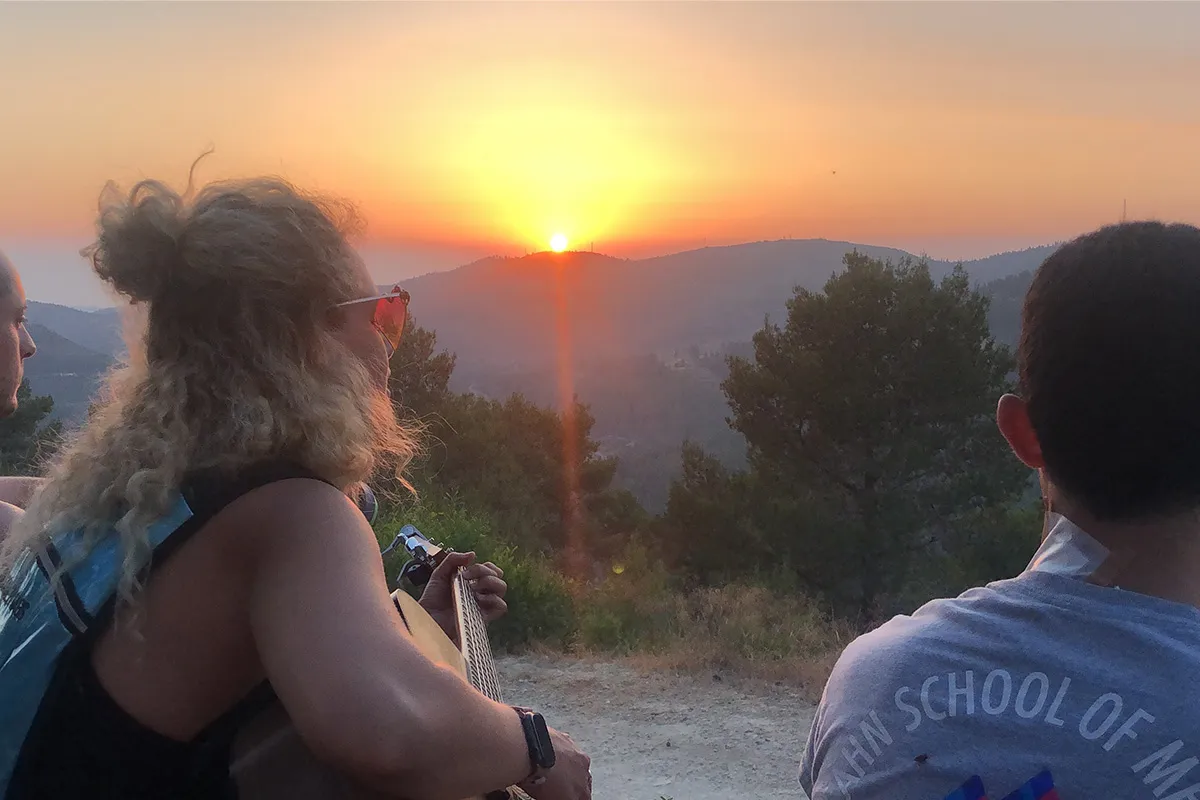 Tori Greene playing the guitar on her Birthright Israel trip