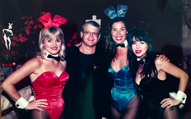 Robert Beleson with three Playboy bunnies during his time as Director of Marketing for the company 