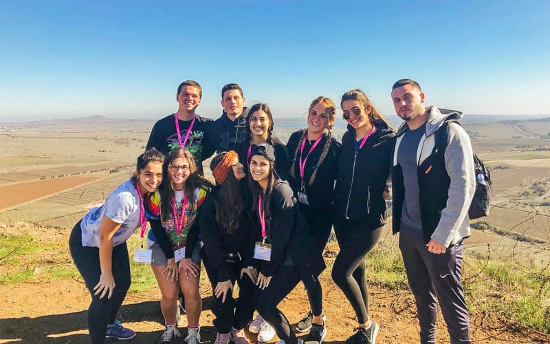 2019 Birthright Israel Mifgash Alumnus Snir Lasri with members of his group in the Golan Heights