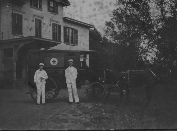 Year 1903, Dr. Clayton and Dr. Bidwell in white uniforms in front of Hahnemann Hospital horse drawn ...