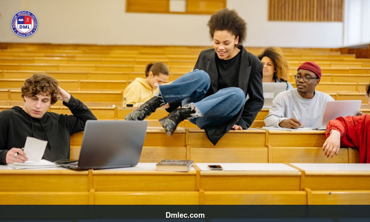 Group of medical students attentively listening in a lecture hall taking notes