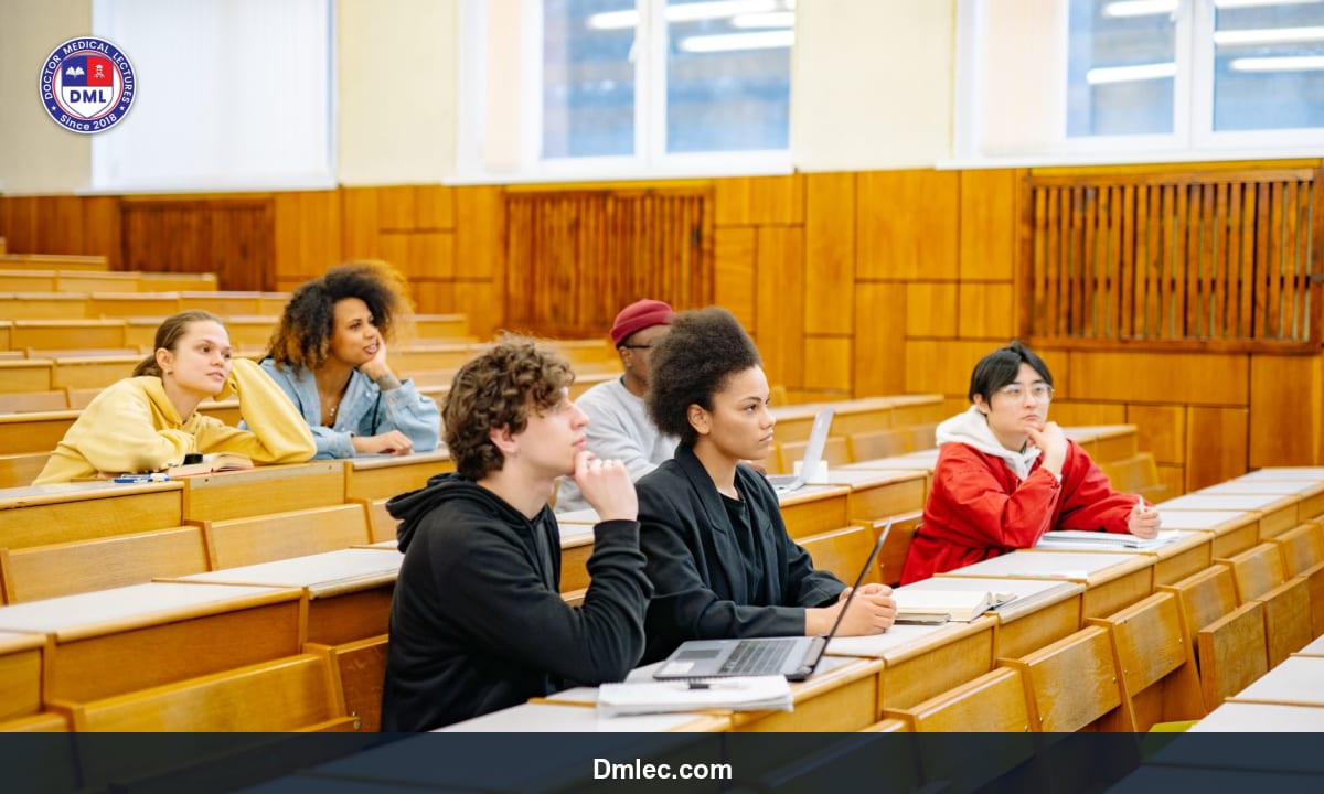 Students attentively listening in a medical lecture hall taking notes