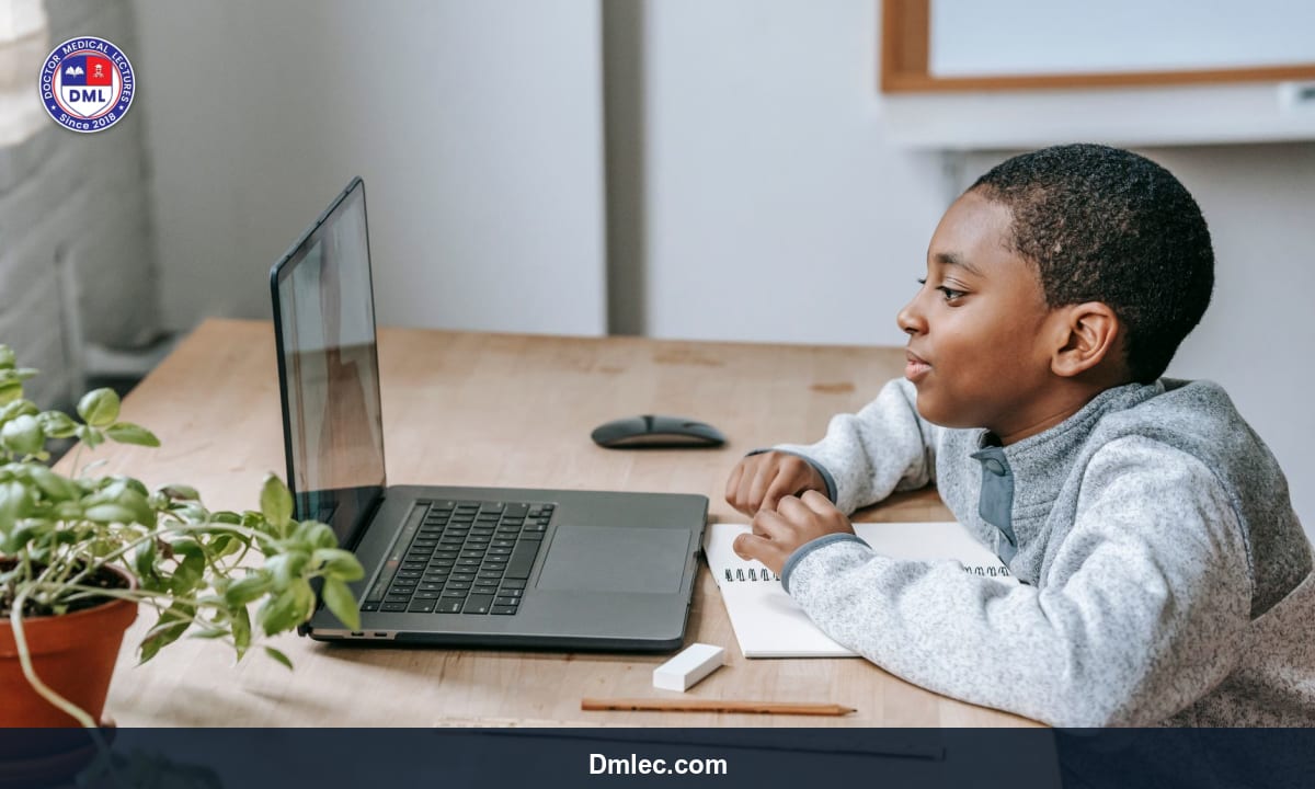 Medical graduate attending an online lecture on a laptop at home