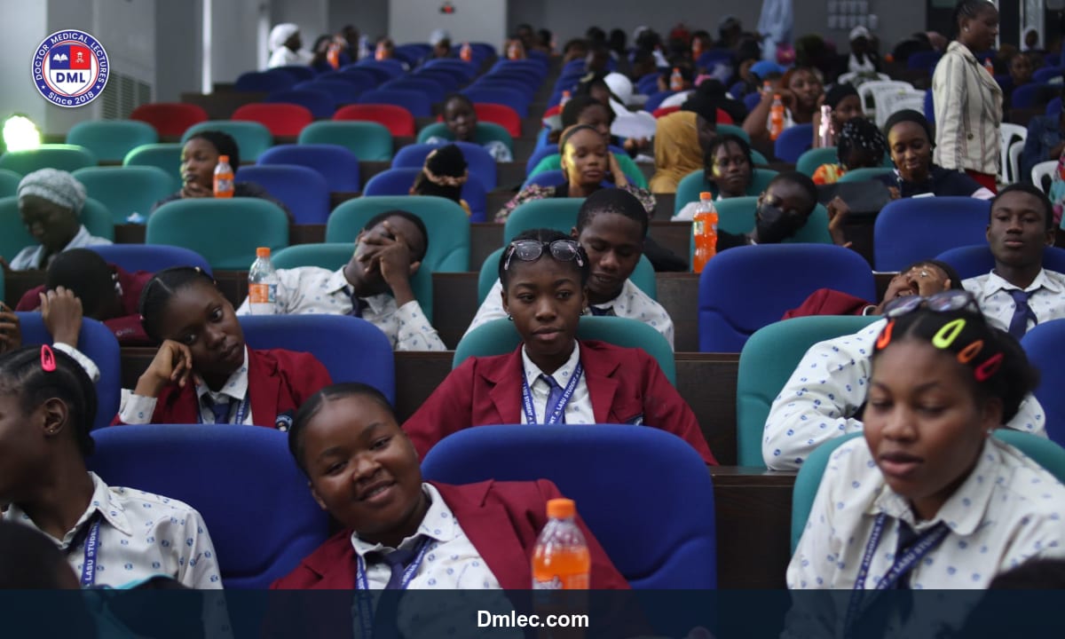 Students attending an online medical lecture on laptops in a virtual classroom setting