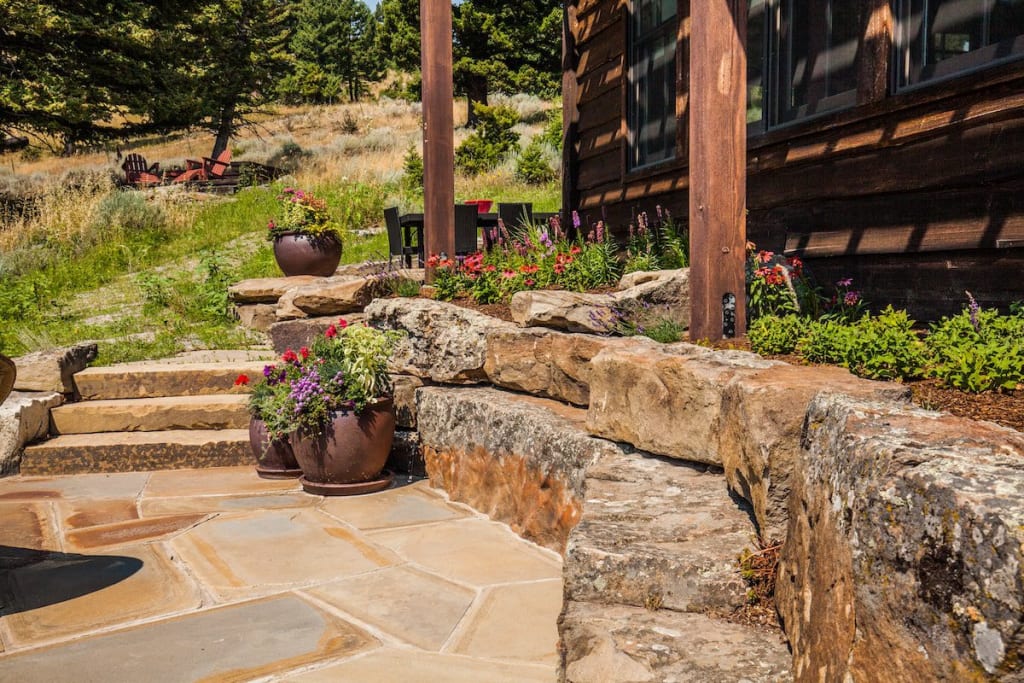 Place a second row: boulder retaining wall