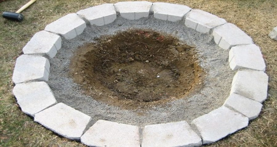 Apply cement: How To Build a Retaining Wall Around a Tree on a Slope
