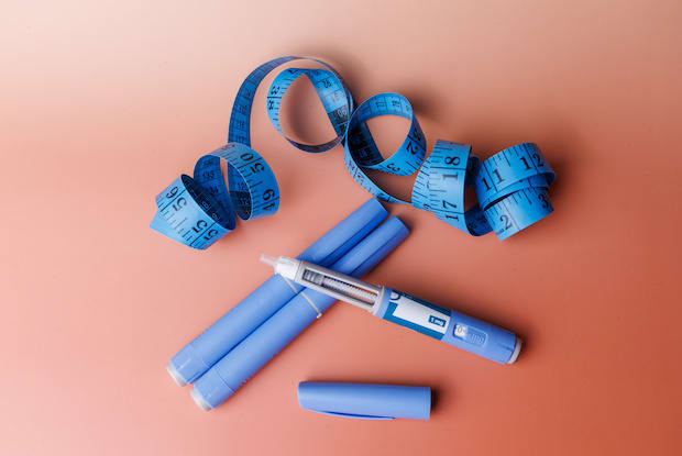 a measuring tape on a colourful background