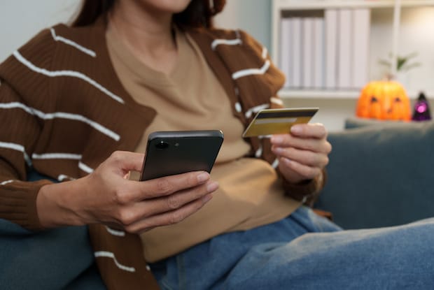 a person filling in their credit card information for online shopping