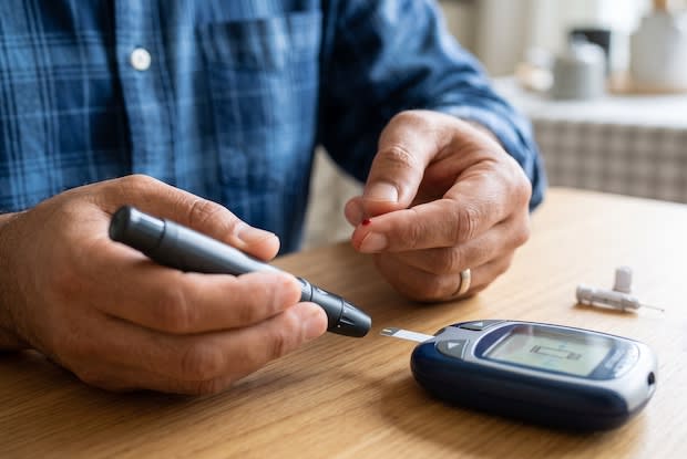 a man with diabetes assessing his blood sugar levels